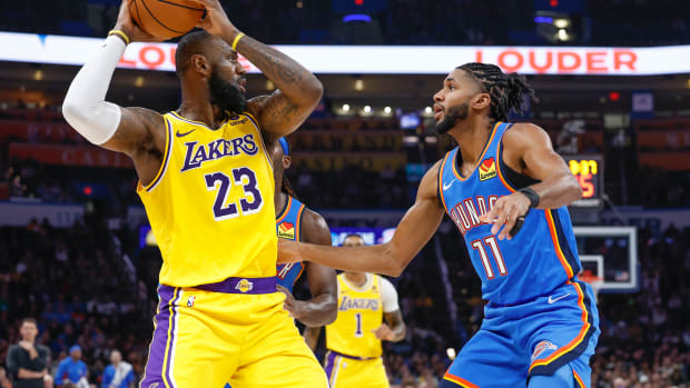 Nov 30, 2023; Oklahoma City, Oklahoma, USA; Oklahoma City Thunder guard Isaiah Joe (11) defends Los Angeles Lakers forward LeBron James (23) during the second quarter at Paycom Center.